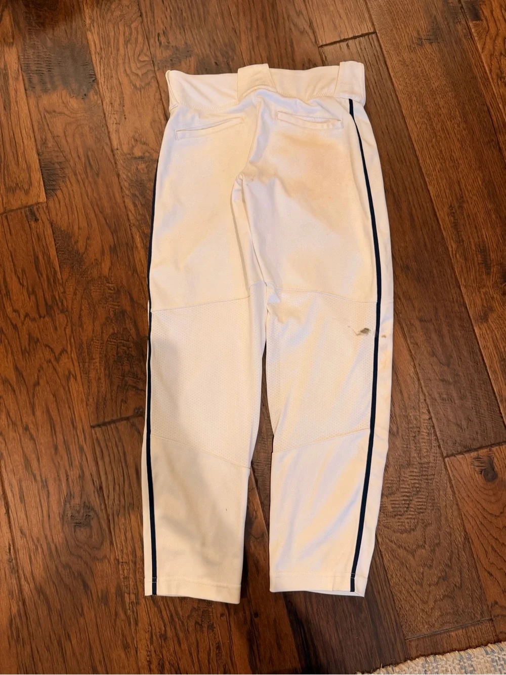 Nike White Kids Baseball Pants with Navy Swoosh and Side Stripe